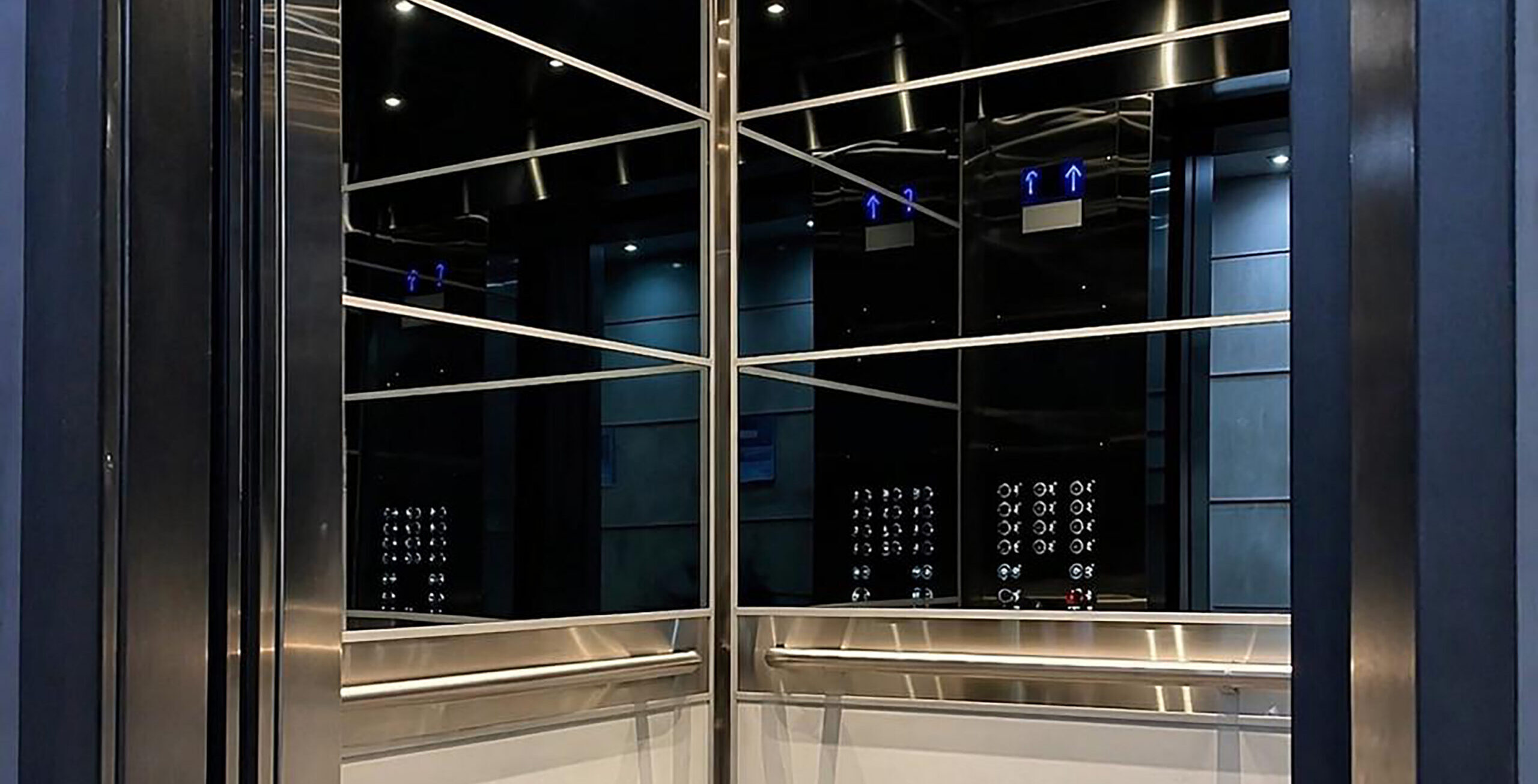 Elevator inside with elevator mirror glass by Raw Glass
